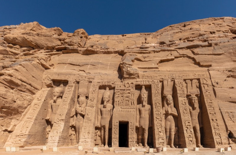 Four colossal seated statues of Ramesses II on the facade of Abu Simbel's Great Temple