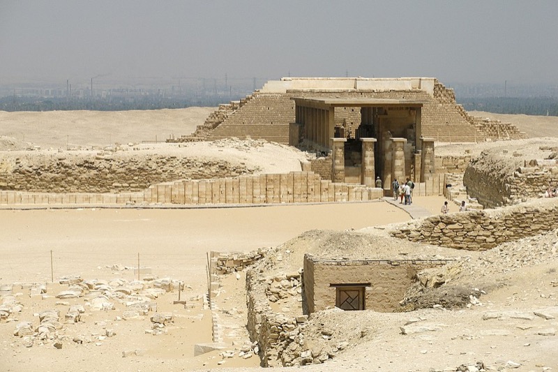 Step Pyramid of Djoser at Saqqara seen across the desert with excavation equipment in foreground