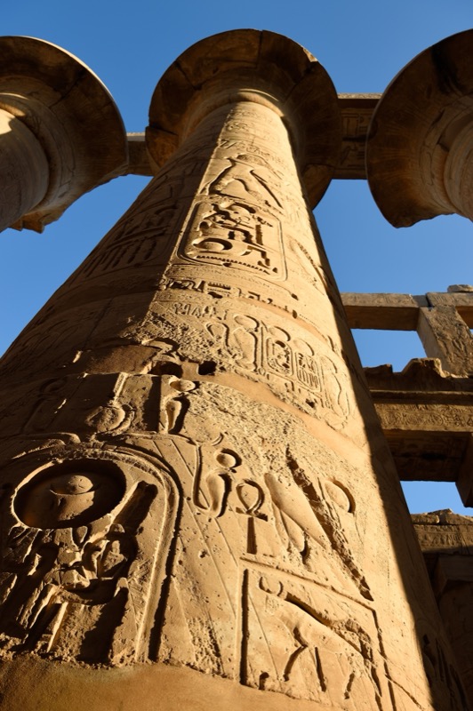 Massive sandstone columns of the Great Hypostyle Hall at Karnak Temple, Luxor